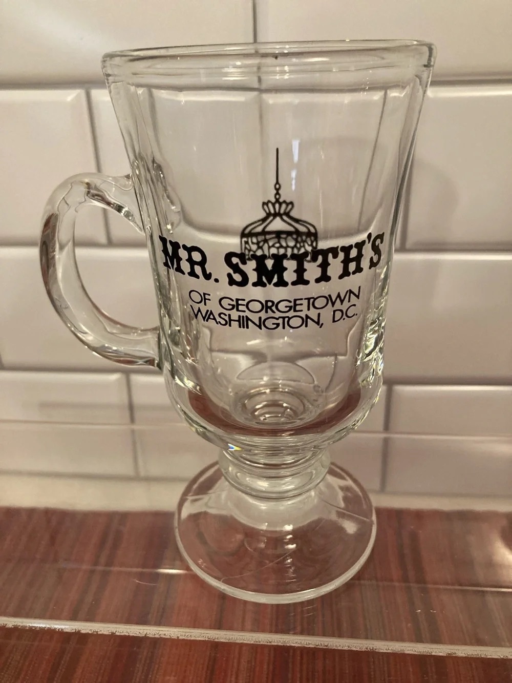 Clear Glass Pedestal Mug with Black Logo